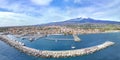 Riposto- vista aerea dall\'alto sul porto della cittÃ  durante giornata di sole con Etna sullo sfondo